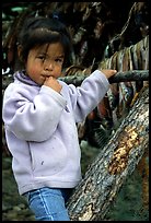 Inupiaq Eskimo girl near drying fish, Ambler. North Western Alaska, USA (color)