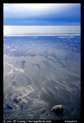 Sand patterns and stormy skies on the Bay. Homer, Alaska, USA (color)