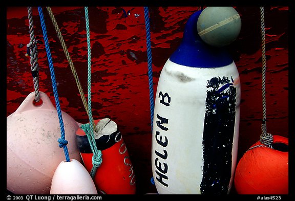 Buoys hanging on the side of a boat. Homer, Alaska, USA (color)