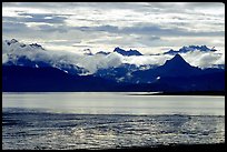 Low clouds haning over Kenai Mountains across Katchemak Bay. Homer, Alaska, USA (color)