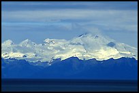 Mt Iliamna, a volcano in Lake Clark National Park, seen across the Cook Inlet. Ninilchik, Alaska, USA