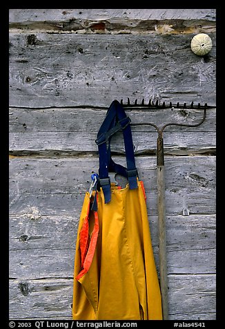 Waders hanging on a cabin wall. Ninilchik, Alaska, USA