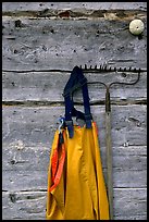 Waders hanging on a cabin wall. Ninilchik, Alaska, USA