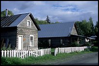 White picket fence and wooden houses. Hope,  Alaska, USA ( color)