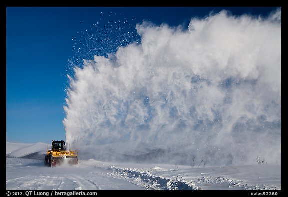 Snow plow truck with cloud of snow. Alaska, USA (color)