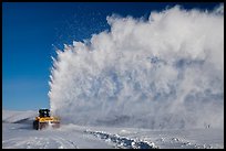 Snow plow truck with cloud of snow. Alaska, USA