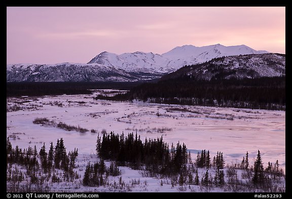Frozen river and mountains at sunset. Alaska, USA (color)