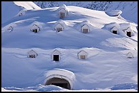 Snow-covered igloo-shaped building. Alaska, USA