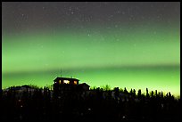 House and Northern Lights filled sky. Alaska, USA ( color)