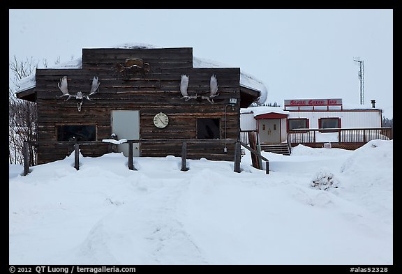 Log cabin and Slate Creek Motel, Coldfoot. Alaska, USA (color)