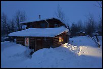 Log cabin at night. Wiseman, Alaska, USA