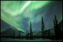 Aurora Borealis above Brooks Range in winter. Alaska, USA