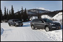 Car being pulled out of snowbank. Wiseman, Alaska, USA (color)