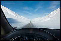 Road in wintry landscape seen from dashboard indicating -32F temperature. Alaska, USA ( color)