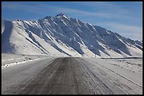 Frozen James Dalton Highway below Arctic Mountains. Alaska, USA