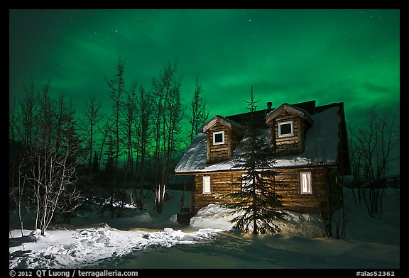 Cabin at night with Aurora Borealis. Wiseman, Alaska, USA