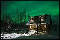 Cabin at night with Aurora Borealis. Wiseman, Alaska, USA (color)