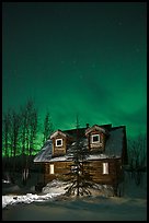 Cabin at night with Northern Lights. Wiseman, Alaska, USA