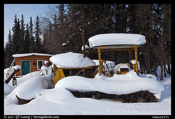 Machinery covered in snow. Wiseman, Alaska, USA