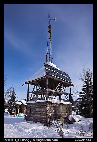 Tower with solar panels and windmill. Wiseman, Alaska, USA (color)