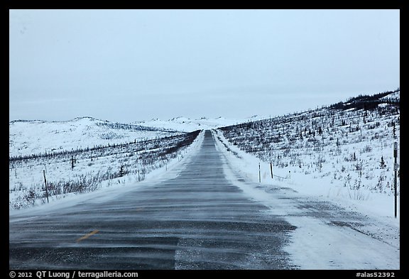 Windblown drifted snow across Dalton Highway. Alaska, USA