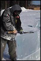 Ice artist carving with saw. Fairbanks, Alaska, USA ( color)