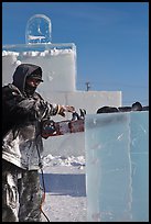 Sculptor using electric saw to carve ice. Fairbanks, Alaska, USA