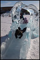 Children slide through ice sculpture. Fairbanks, Alaska, USA (color)