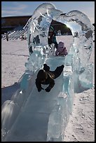 Children slide through ice sculpture. Fairbanks, Alaska, USA