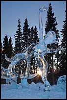 Sun setting over ice sculpture, World Ice Art Championships. Fairbanks, Alaska, USA (color)