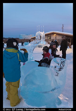 Children playing on ice sculptures, Ice Alaska. Fairbanks, Alaska, USA