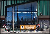 Post office sign with candy stripped canes. North Pole, Alaska, USA (color)