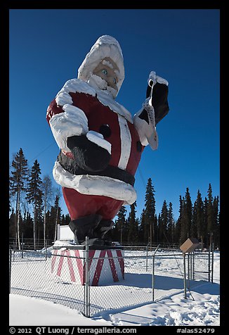 Santa Claus statue surrounded by barbed wire. North Pole, Alaska, USA