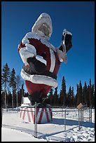 Santa Claus statue surrounded by barbed wire. North Pole, Alaska, USA (color)