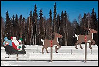 Santa Claus and reinder cut-out in winter. North Pole, Alaska, USA ( color)