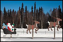 Santa Claus and reinder cut-out in winter. North Pole, Alaska, USA (color)