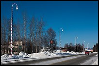 Main street and white street lights with red stripes. North Pole, Alaska, USA