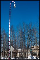 Street light decorated with a candy cane motif. North Pole, Alaska, USA