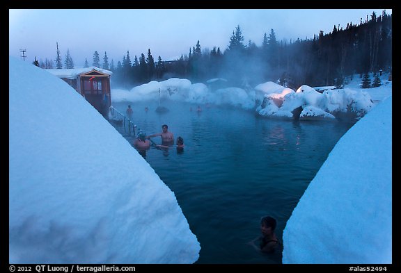 Soaking in natural hot pool surrounded by snow. Chena Hot Springs, Alaska, USA