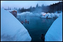 Soaking in natural hot pool surrounded by snow. Chena Hot Springs, Alaska, USA ( color)
