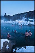 People soak in natural hot springs in winter. Chena Hot Springs, Alaska, USA