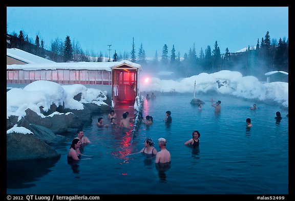 People soaking in outdoor hot springs pool in winter. Chena Hot Springs, Alaska, USA (color)