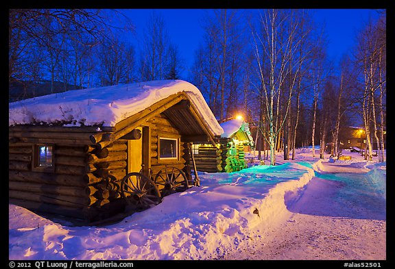 Path in snow and cabins at night. Chena Hot Springs, Alaska, USA (color)