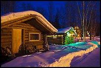 Cabins at night in winter. Chena Hot Springs, Alaska, USA (color)