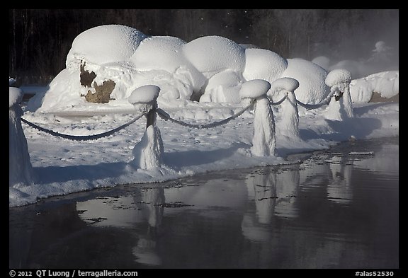 Frozen fence and snow-covered rocks. Chena Hot Springs, Alaska, USA (color)