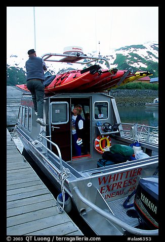 Kayaks loaded on a water taxi in Whittier. Whittier, Alaska, USA (color)