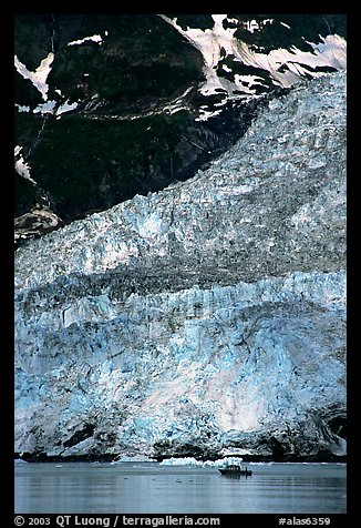 Boat at the base of Barry Glacier. Prince William Sound, Alaska, USA