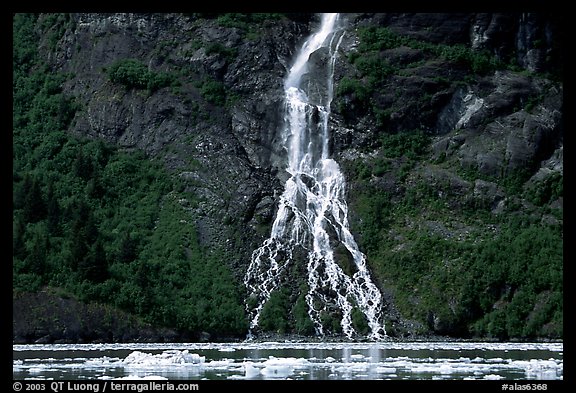 Waterfall dropping into the sea. Prince William Sound, Alaska, USA