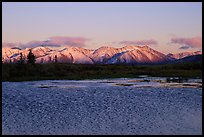 Lake with water ripples and mountains at sunset. Alaska, USA (color)