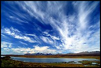 Clouds, tundra and lake along Denali Highway. Alaska, USA